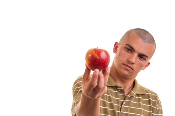 Closeup portrait of a healthy young man holding and offering an — Stock Photo, Image