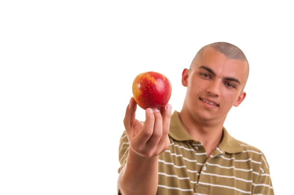 Closeup portrait of a healthy young man holding and offering an — Stock Photo, Image