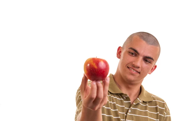 Closeup portrait of a healthy young man holding and offering an — Stock Photo, Image