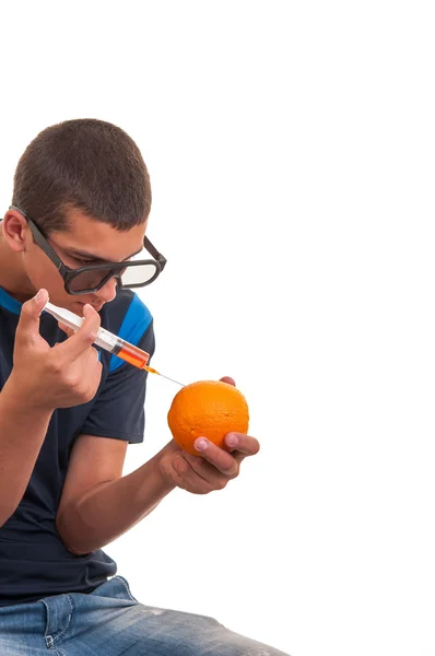 Young teen happy to do experiments with fruits for chemistry lab — Stok fotoğraf