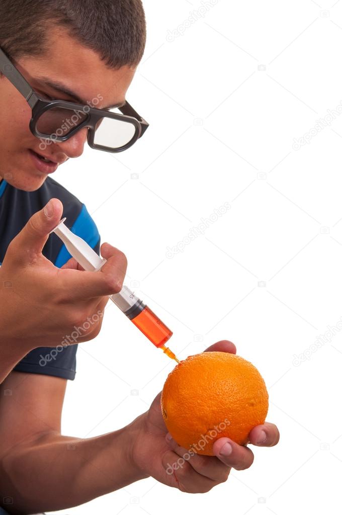 Young teen happy to do experiments with fruits for chemistry lab