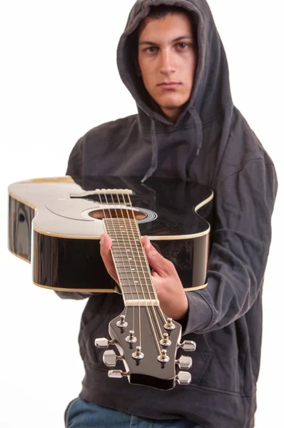 A young boy in hoodie show's you his guitar — Stock Photo, Image