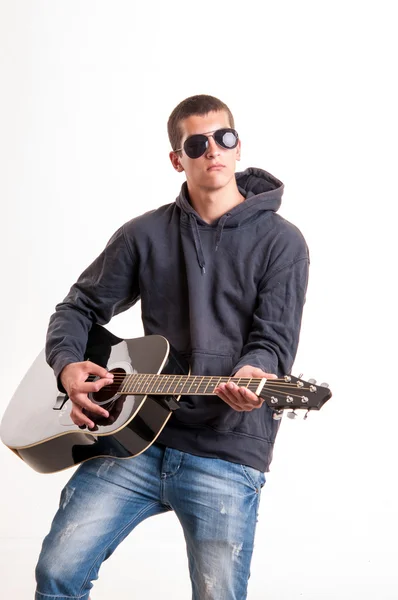 Image of teenager in black clothes, hoodie and sunglasses who is — Stock Photo, Image