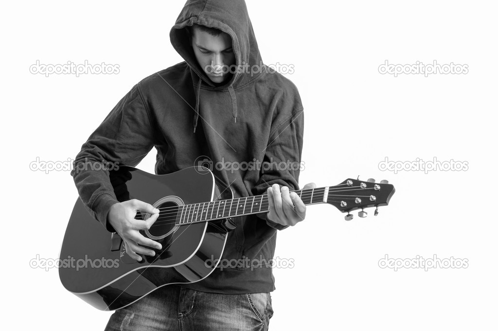 Pensive Teenager dressed in a hoodie, writing a song about life