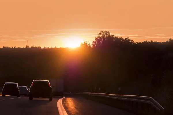 Sunset on highway — Stock Photo, Image