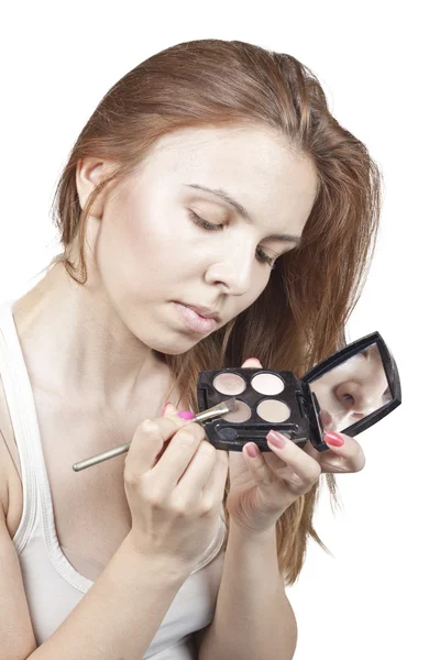 The girl does makeup — Stock Photo, Image