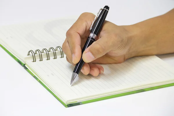 Writing an appointment on the empty notebook — Stock Photo, Image