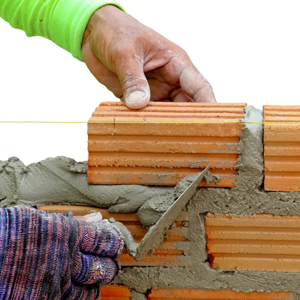 Red brick wall creating with cement mortar isolated over white b — Stock Photo, Image