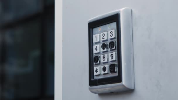 Female entering password at electronic entry lock. Woman opens electronic lock using code — Stock Video