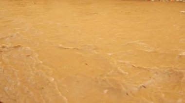 Polluted brown river water and environment calamity. Environmental water pollution