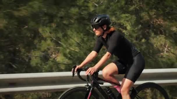 Cyclist riding bicycle in mountains. Cyclist pedaling bike, doing  endurance exercising — Stock Video