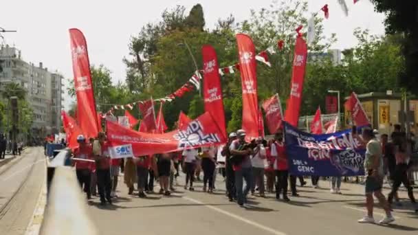 People walking with posters turkish communist party in Antalya,Turkey,01.05.2022 — Wideo stockowe