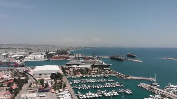 Cruise ship moored at dock. Large industrial ships moored in commercial sea port — Stockvideo