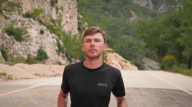 Runner athlete jogging workout. Fitness sport activity. Active man running in forest