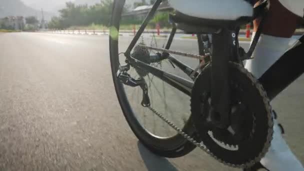 Professional Male Road Cyclist Riding Bicycle Morning Sunlight Close Legs — Stock Video