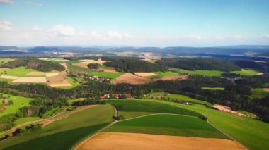 Beautiful green mountain hills and valley. Mountain landscape with lush green hills and agricultural fields. Small mountain village surrounded by green hills. Nature landscape