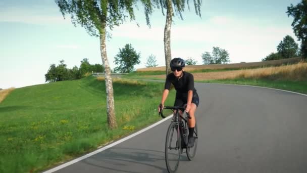 Professional Road Cyclist Fit Sportive Female Athlete Riding Bicycle Countryside — Stockvideo