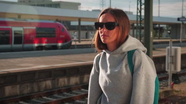 Portrait Young Brunette Woman Sunglasses Backpack Waiting Train Railway Station — 图库视频影像