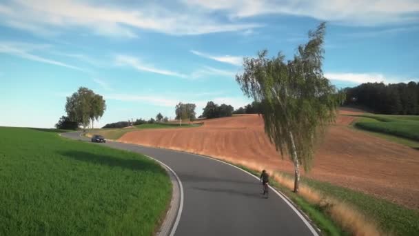 Road Cycling Professional Road Cyclist Riding Bicycle Uphill Sunny Summer — Vídeo de Stock