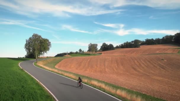 Cycling Triathlon Concept Professional Road Cyclist Riding Fast Uphill Pushing — стоковое видео