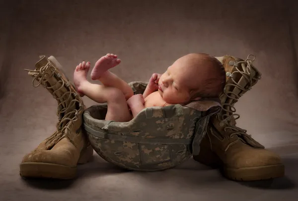 Newborn In Military Helmet — Stock Photo, Image