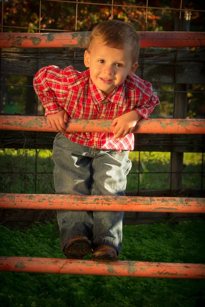 Young Boy Climbing Fence — Stock Photo, Image