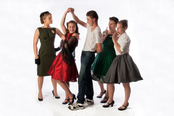 Un jeune couple danse le swing avec un public Images De Stock Libres De Droits