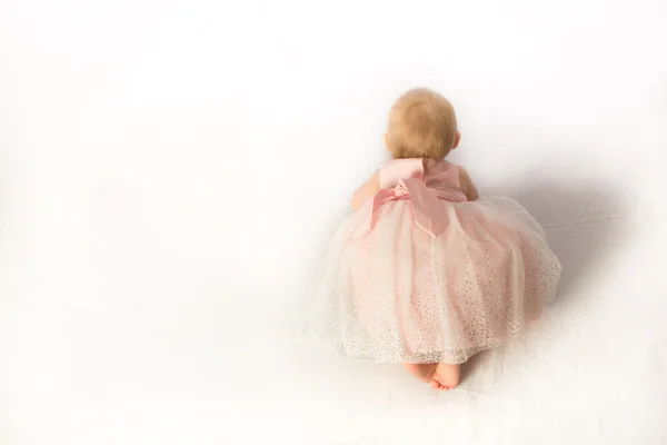 Baby Girl in Pink Frilly Dress Crawling — Stock Photo, Image