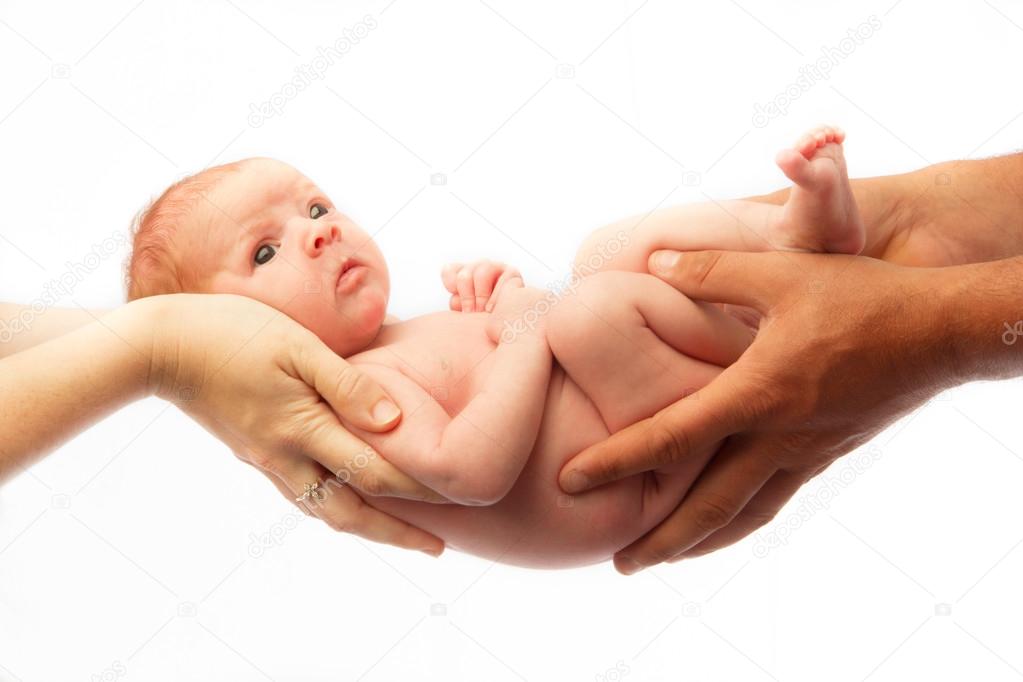 Baby Held By Both Parents Stock Photo By C Vedagonzalez