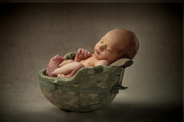 Newborn Baby in Military Helmet — Stock Photo, Image