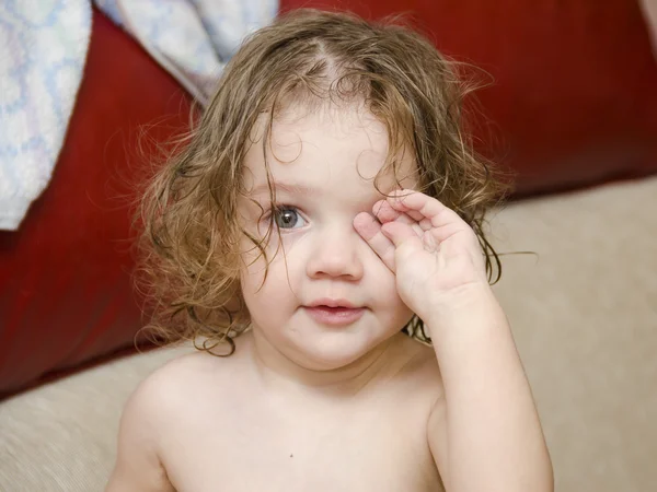 Baby wipes his eyes after swimming handle — Stock Photo, Image