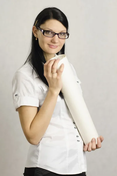 The girl with a roll of paper — Stock Photo, Image
