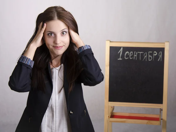 Portrait of a school teacher, that clings to the head — Stock Photo, Image