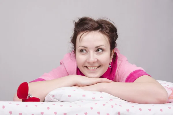 Girl is happy with ring, lying in bed — Stock Photo, Image