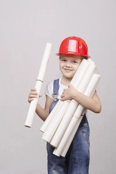 Child in helmet keeps many drawings — Stock Photo, Image