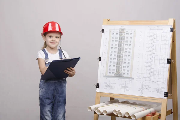 Girl architect is drawing near — Stock Photo, Image