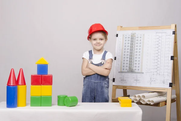 Child Builder builds a house on the drawing — Stock Photo, Image