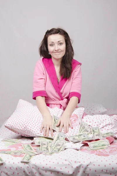 Girl in bed unexpectedly received an inheritance — Stock Photo, Image