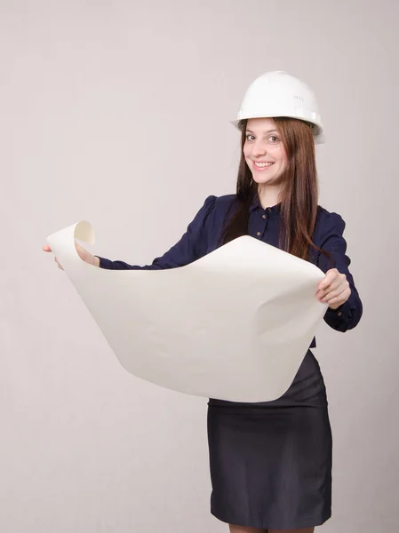 Student project in helmet looks deploying hands drawing — Stock Photo, Image