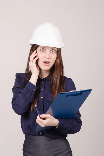 Construction worker shocked by what he heard on phone — Stockfoto