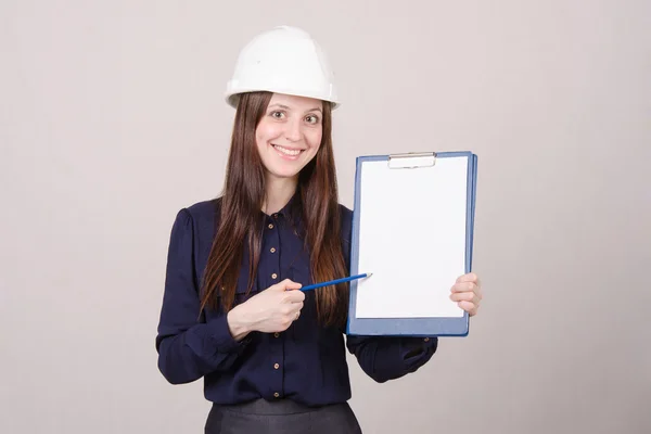 Girl in a helmet advertises inscription — Stock Photo, Image