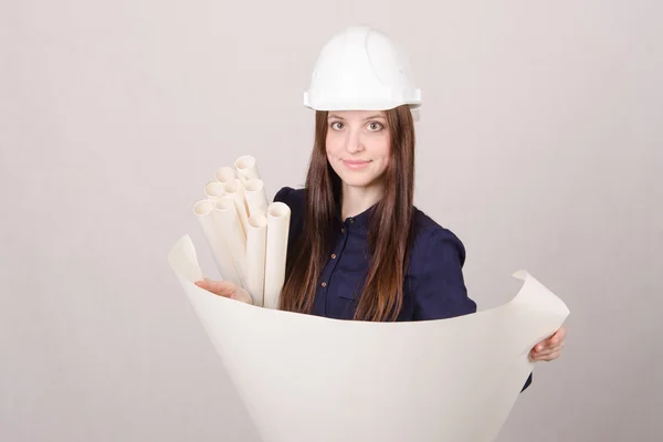 Young girl looking project, deploying hands drawing — Stock Photo, Image