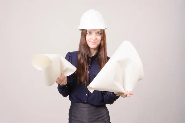 Woman architect in helmet drawing tears — Stock Photo, Image