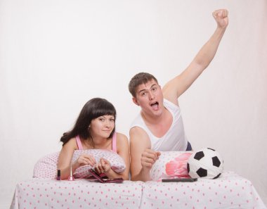 Celebrates after scoring husband, wife watch soccer clipart