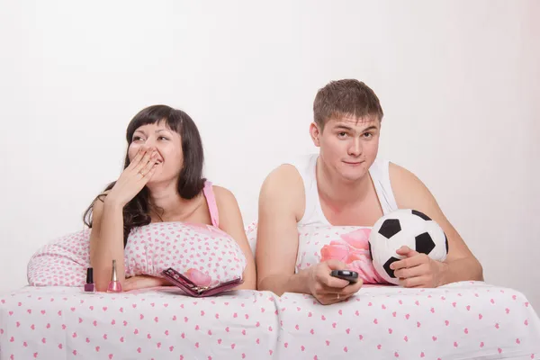 Husband watches football, frankly bored wife — Stock Photo, Image