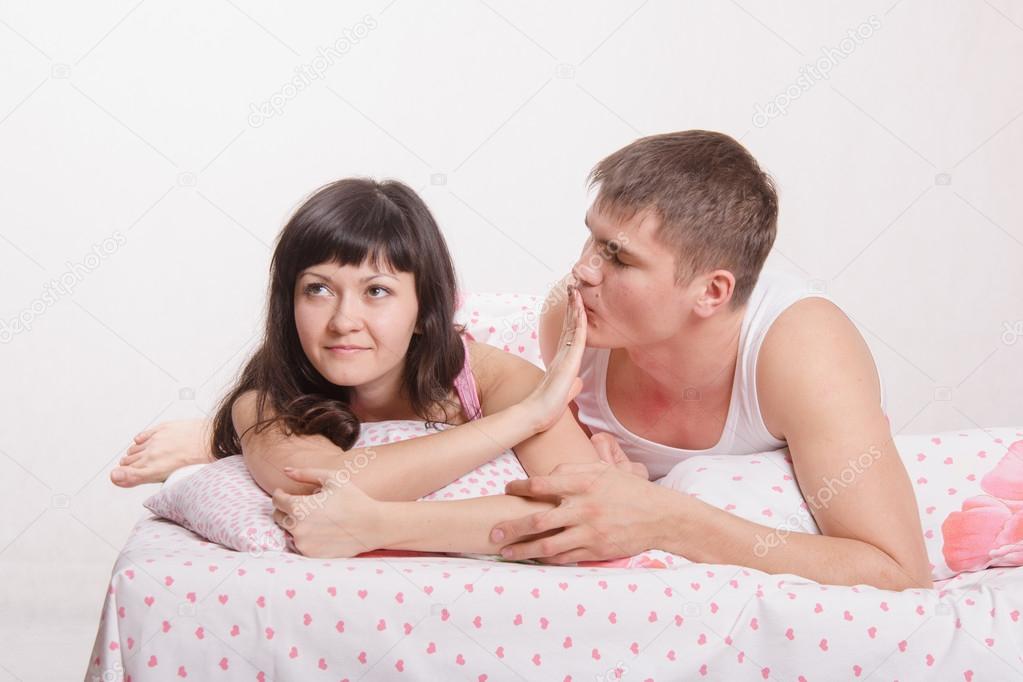 Young girl refuses to kiss a guy in bed