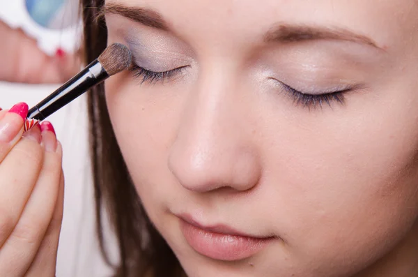 Beautiful girl paint eyelids — Stock Photo, Image