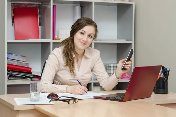 Girl writes on paper telephone conversation Royalty Free Stock Photos