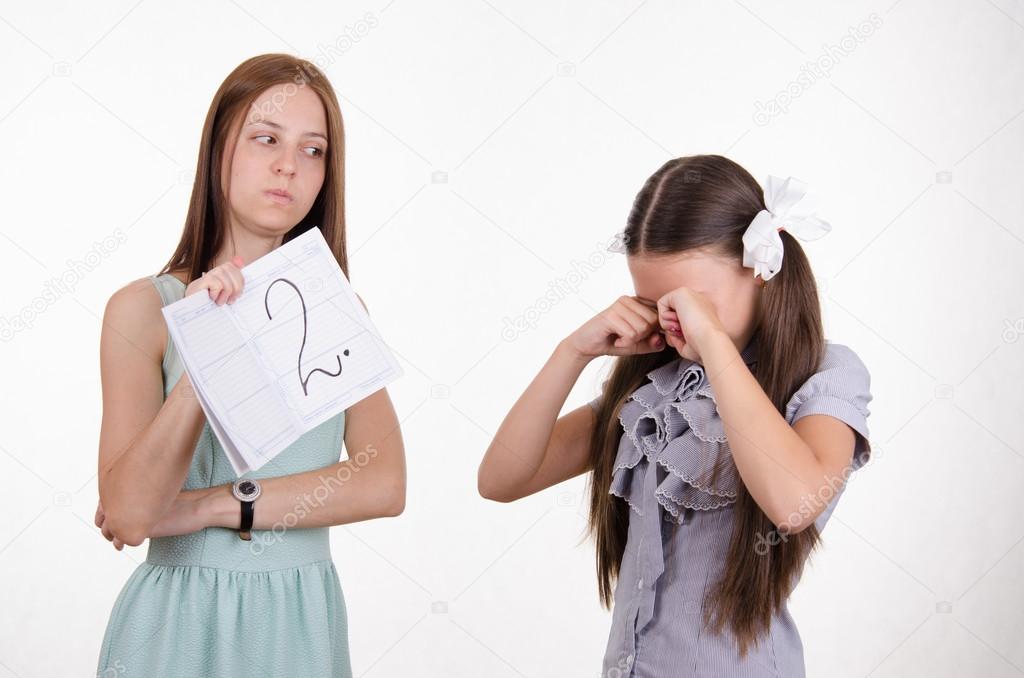 Schoolgirl crying upset because of two received