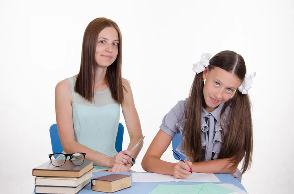 The teacher tells student how to solve problem — Stock Photo, Image